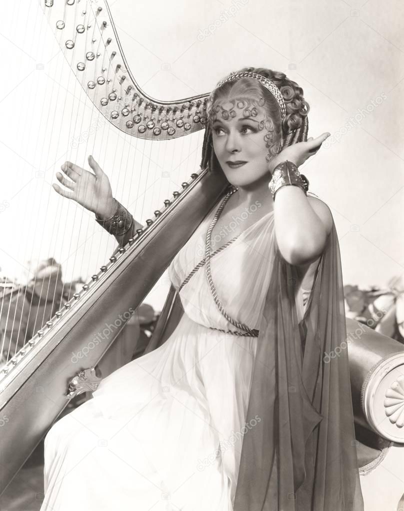  woman playing harp