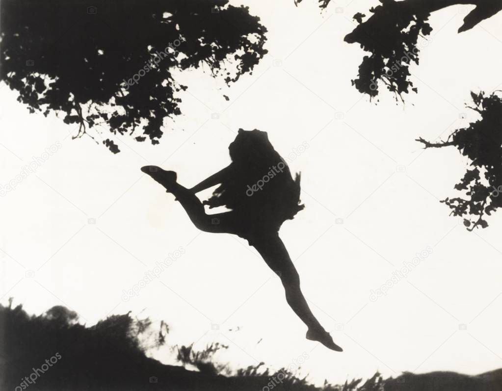  woman jumping against sky