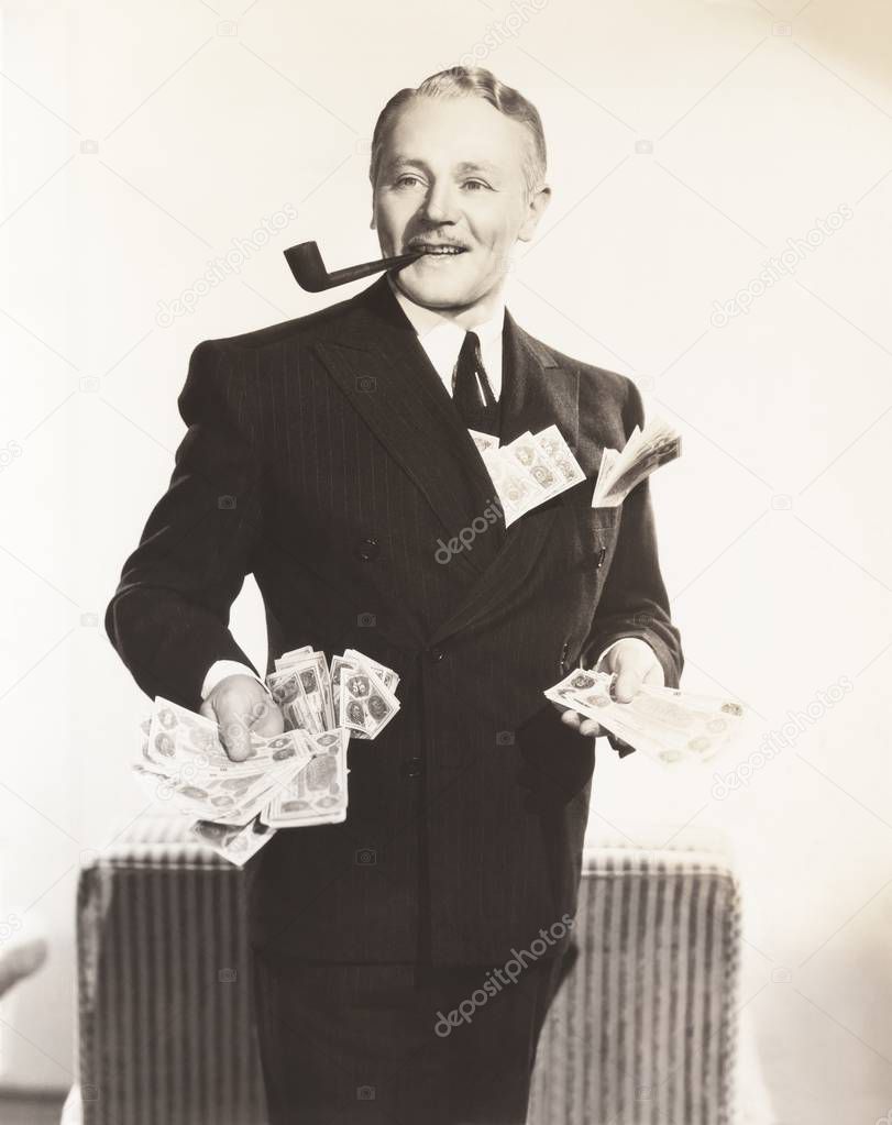 man carrying smoking pipe in mouth 