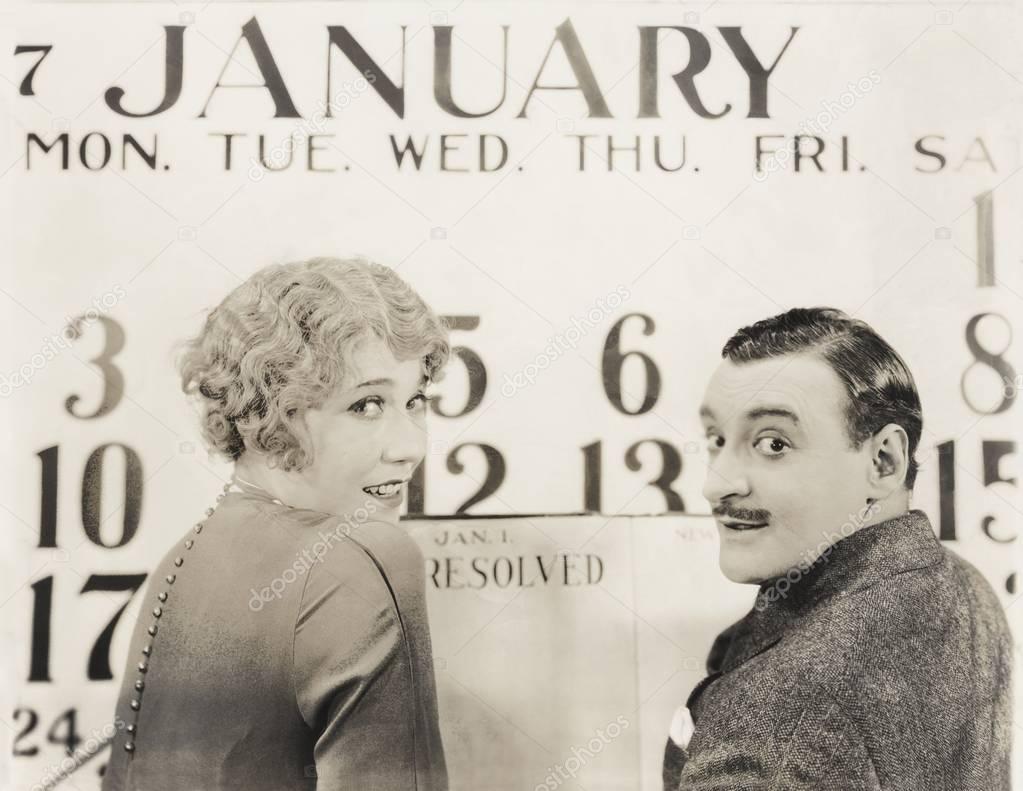  couple against New Year calendar