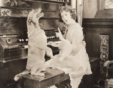 woman teaching dance to dog clipart