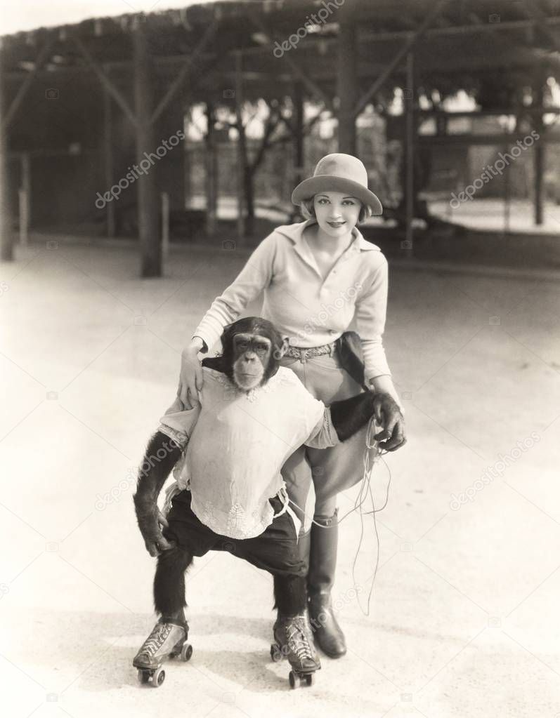 woman with chimpanzee skating