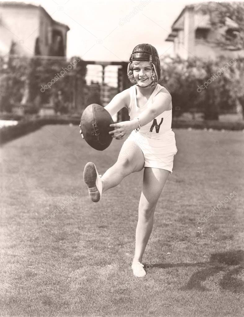 woman playing American football