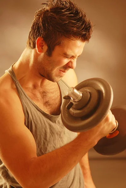 Strong Man Exercising Dumb Bell — Stok fotoğraf