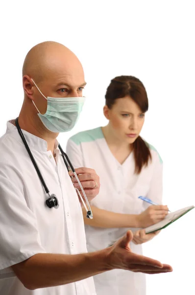 Young Doctor Mask Nurse Writing Notes — Stock Photo, Image