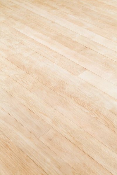 New hardwood floor in a home, UK. Wooden planks texture or background.