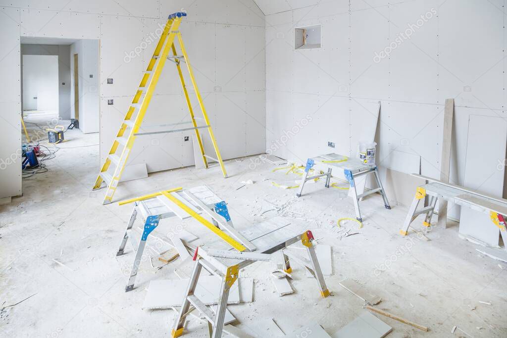 Gypsum plasterboard installation in a room interior during a house renovation