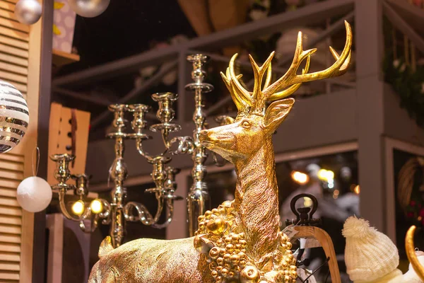 big deer in gold figurine decor . interrior noel disign