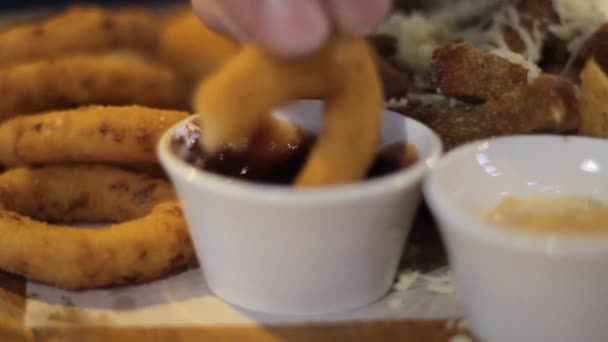Sauce for snacks . sweet sour and cheesy. dunks in the sauce onion ring croutons — 비디오