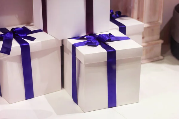 white boxes with gifts decorated with ribbons holiday