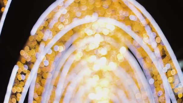 Illuminated Holiday Arch Blurry Bokeh Golden Moon Color Background — Stock Video