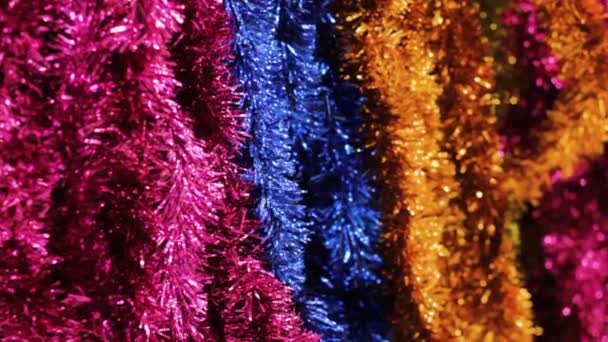 Multicolored Tinsel Garland Christmas Decorations Shiny Palette Background — Stock Video