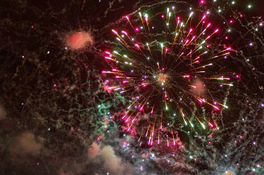 explosion of multicolored fireworks flash in the sky clipart