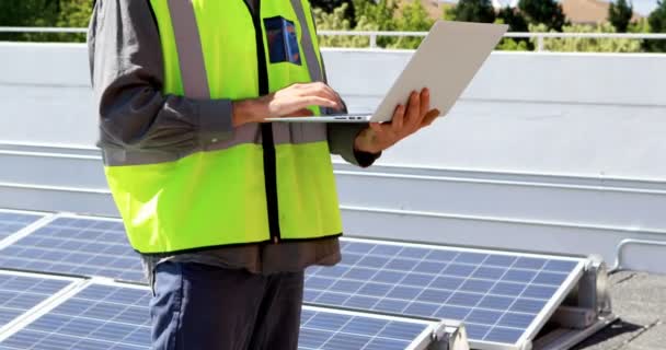 Male Worker Using Laptop Solar Station Sunny Day — Stock Video