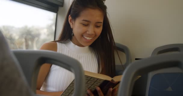 Teenage Girl Reading Book Bus — Stock Video