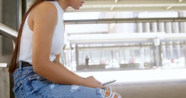 Teenage Girl Using Mobile Phone Bus Stop — Stock Video