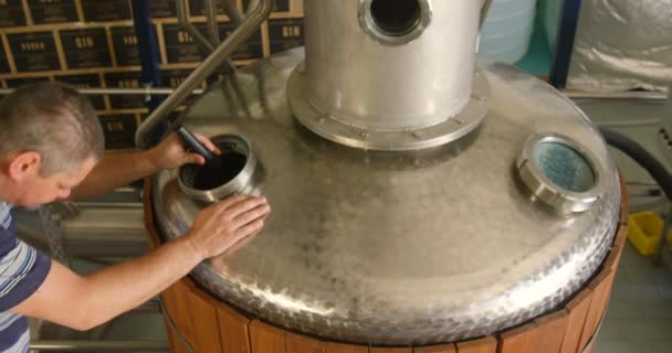 Male Worker Examining Distillation Tank Factory — Stock Video