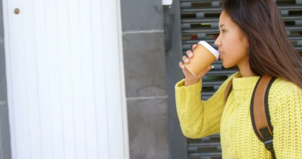Side View Teenage Girl Drinking Coffee While Walking Sidewalk — Stock Video