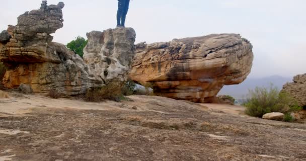 Side View Man Sitting Rock Looking Binoculars — Stock Video
