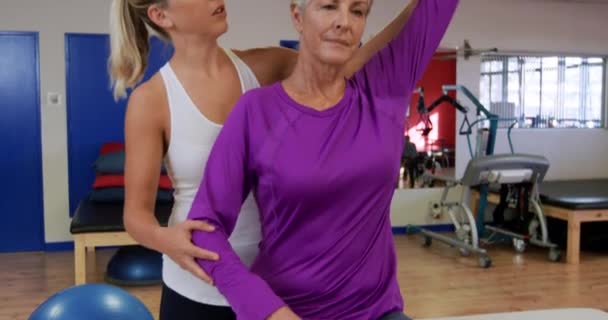 Front View Senior Caucasian Woman Sitting Examination Couch Sports Centre — 비디오