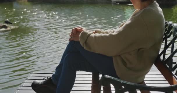 Side View Senior Caucasian Woman Short Grey Hair Sitting Bench — 비디오