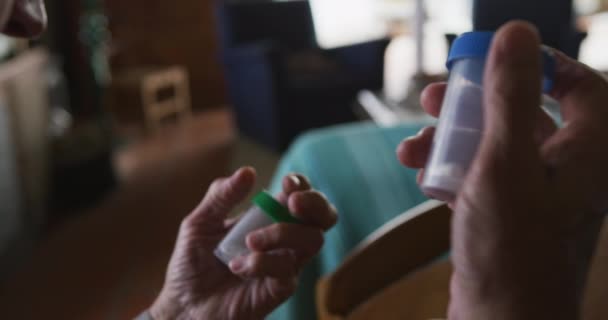 Shoulder Close Hands Senior Caucasian Man Sitting Home Holding Pill — Stock Video