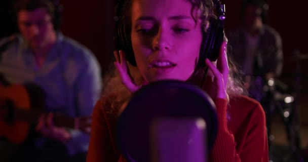 Caucasian Female Singer Blonde Curly Hair Wearing Headphones