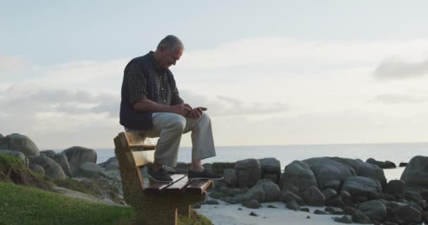 Side View Senior Caucasian Man Sitting Back Bench Countryside Coast — Stock Video