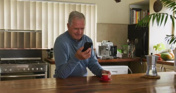 Front View Senior Caucasian Man Relaxing Home Sitting Counter His — ストック動画