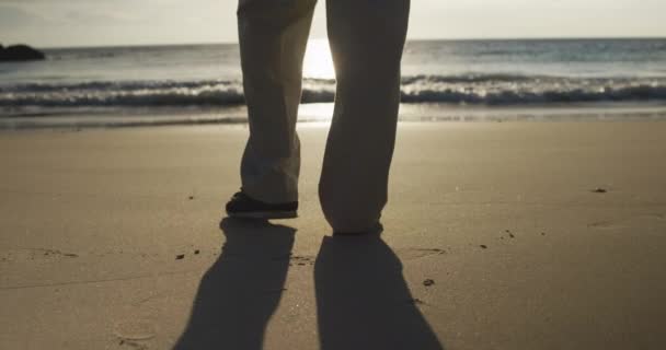 Low Section Senior Caucasian Man Walking Alone Beach Sea Sunset — стокове відео