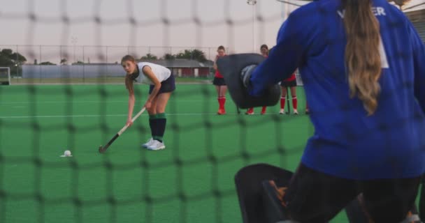 Rear View Goalkeeper Teenage Caucasian Female Hockey Team Action Pitch — Stock Video