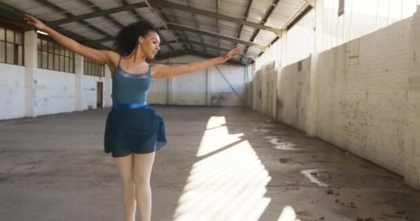 Front View Mixed Race Female Ballet Dancer Practicing Empty Warehouse — Stock Video