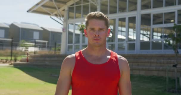 Portrait Confident Caucasian Male Runner Wearing Red Vest Training Sports — Stockvideo