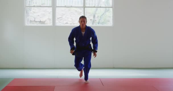 Front View Teenage Caucasian Female Judoka Wearing Blue Judogi Warming — Stock Video