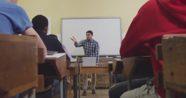 Front View Caucasian Male High School Teacher Standing Desk Front — Stock Video