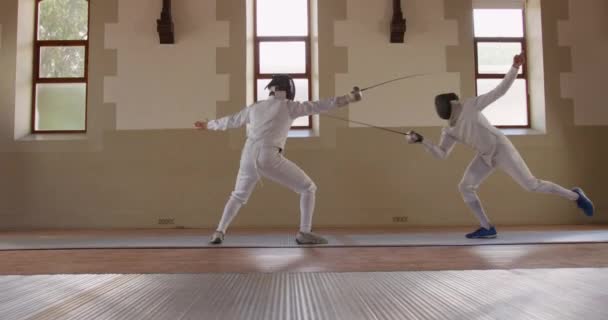 Side View Caucasian Mixed Race Male Fencer Athletes Fencing Training — Stock Video