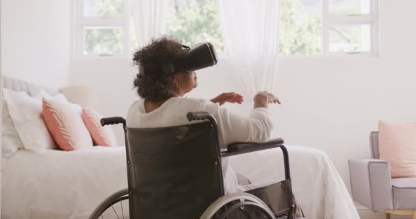 Senior Mixed Race Woman Enjoying Her Time Home Sitting Wheelchair — Stock Video