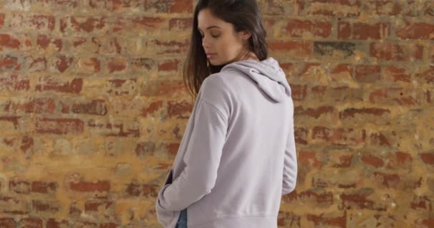 Rear View Caucasian Woman Wearing Grey Hooded Top Standing Brick — Stock Video