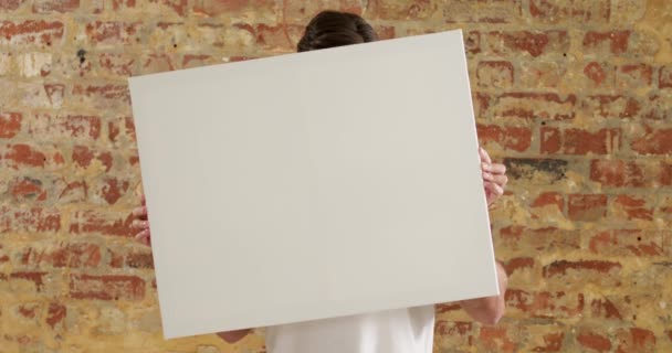 Caucasian Man Holding Blank White Canvas His Hands Which Covers — Stock Video