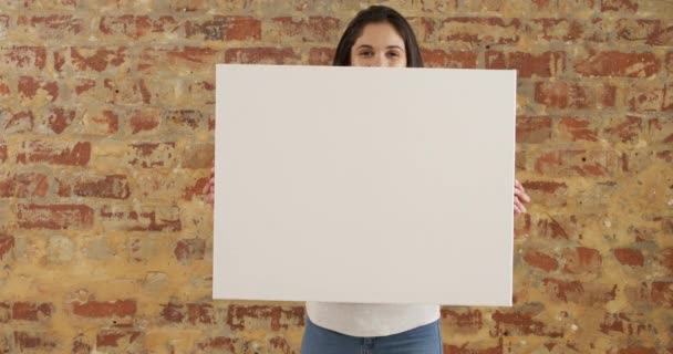 Portrait Caucasian Woman Holding Blank White Canvas Her Hands Looking — Stock Video