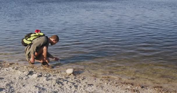 Caucasian Man Having Good Time Trip Mountains Crouching Shore Drinking — Stock Video