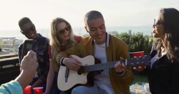 Multi Ethnic Group Friends Hanging Out Roof Terrace Together Caucasian — Stock Video