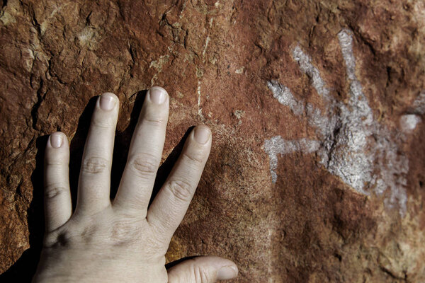 Handprints on rock