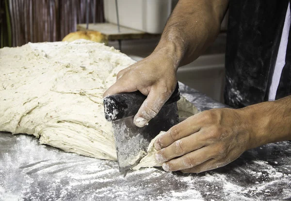 Man kneading bread — Stock Photo, Image