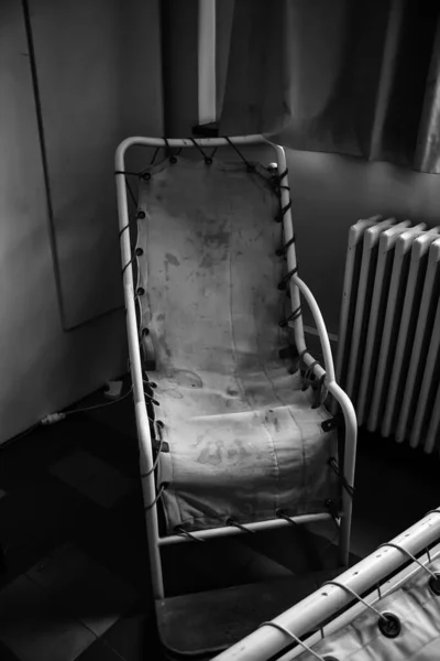 Old stretcher in psychiatric hospital, medicine and health