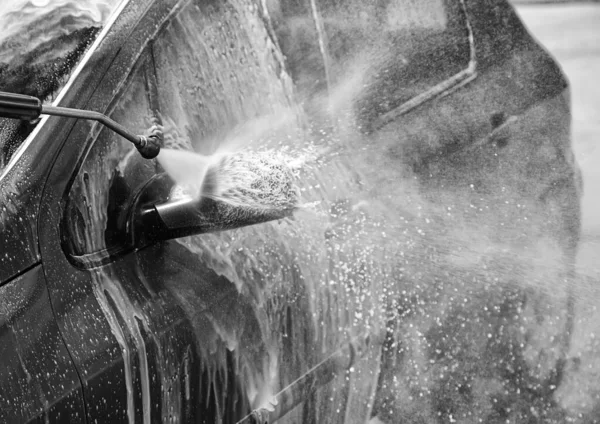 Car in industrial car wash, hygiene and cleaning of vehicles