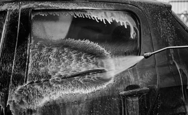 Car in industrial car wash, hygiene and cleaning of vehicles