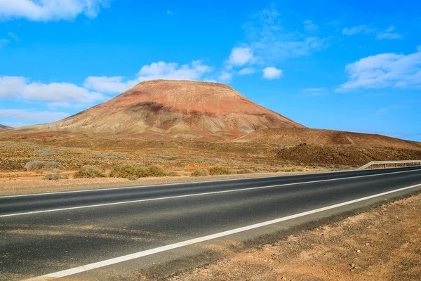 Road to Corralejo along desert with volcanoes, Fuerteventura, Canary Islands, Spain