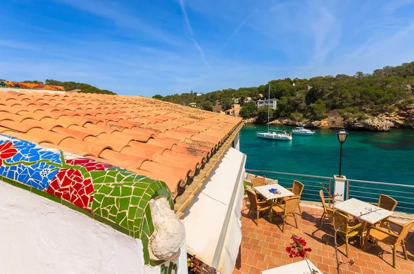 Restaurant terrace table chair bay sea view, Cala Figuera, Majorca island, Spain