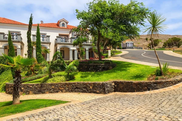 MADEIRA ISLAND, PORTUGAL - AUG 21, 2013: hotel apartments and gardens in luxury resort on southern coast of Madeira island. Many tourists spend holidays here due to wonderful climate.